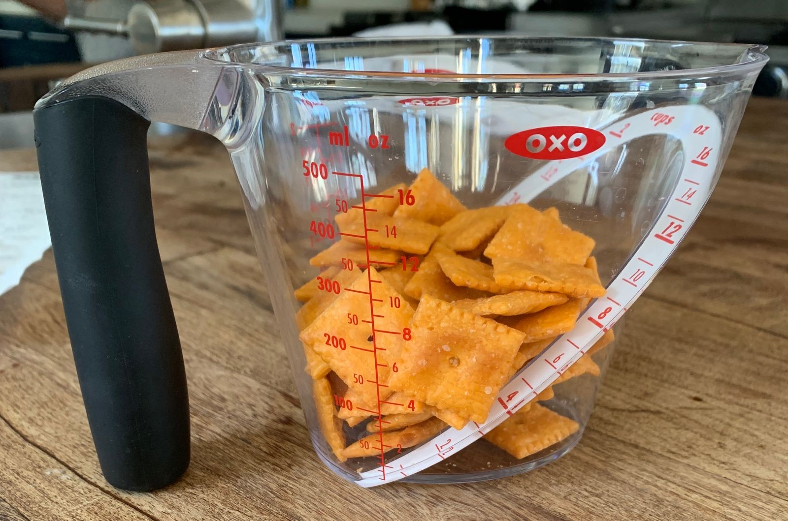 A picture of 50 Cheez-Its in an oxo measuring cup
